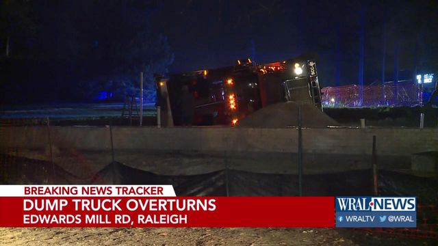 Dump truck overturns in Raleigh