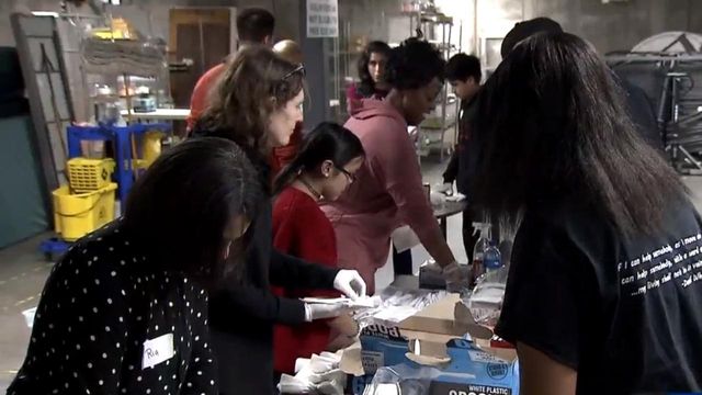 Volunteers gather to prepare meals for annual holiday event