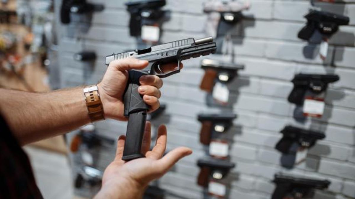 Man loading handgun
