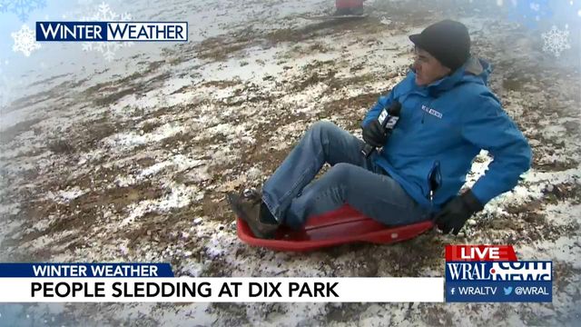 WATCH: WRAL's Bryan Mims goes airborne while sledding on live TV