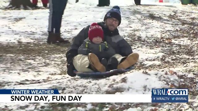 Snowy conditions allow children, even adults, to have some fun