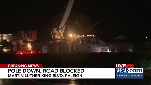Car crash topples pole, blocking road in Raleigh