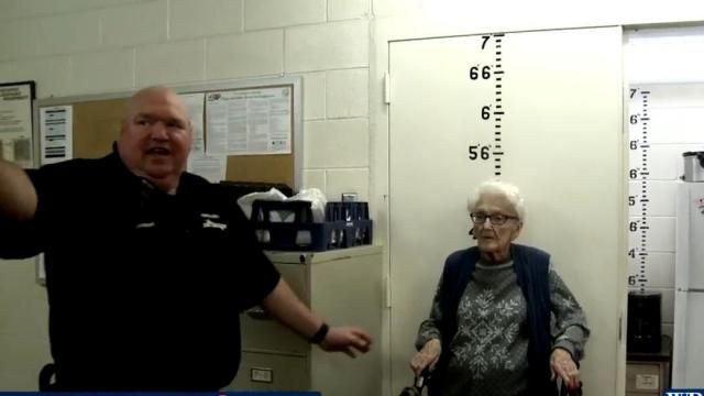 Posing for her jailhouse portrait