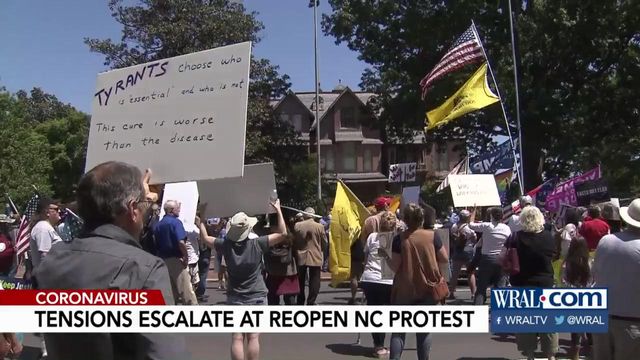 Emotions high, face masks rare at ReOpenNC protest