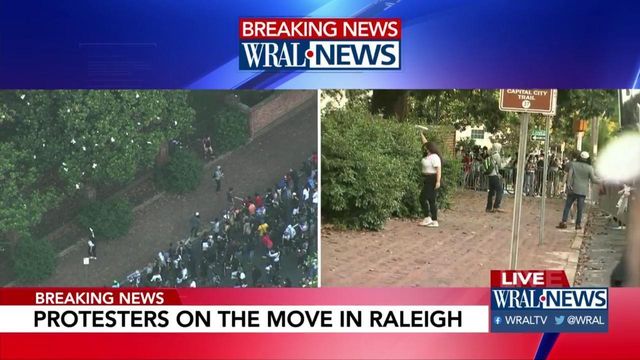 Protesters toss paper airplanes toward Governor's mansion