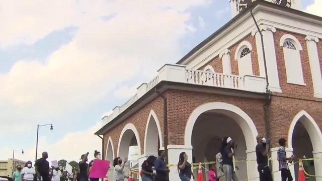 Fayetteville protesters march Friday from City Hall to Market House