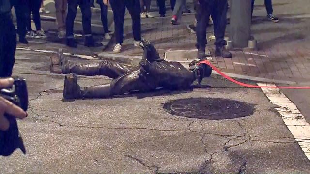 Protesters topple, drag Confederate statue in downtown Raleigh