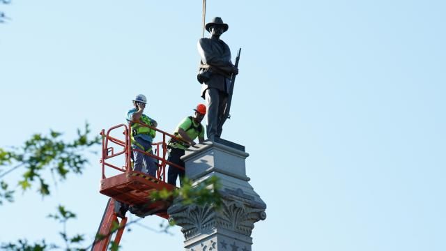 Crews work to remove the Confederate soldier statue was taken down at the State Capitol
