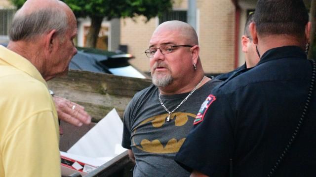 Man is arrested in downtown Graham during a Confederate protest. Pictured is Sheriff Johnson of Alamance County and the Graham Police Department.