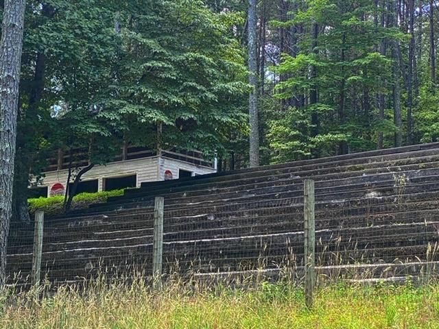 Thousands of fans once sat in these stands. Vintage Pepsi Cola logos decorate the grand stands in the background.