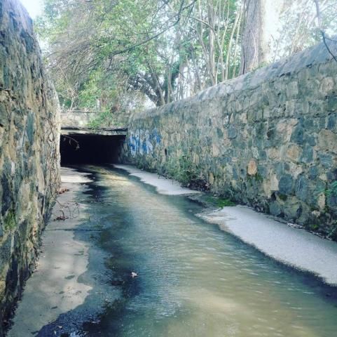 Antique cobblestone aqueduct that runs beneath Devereux Meadow
