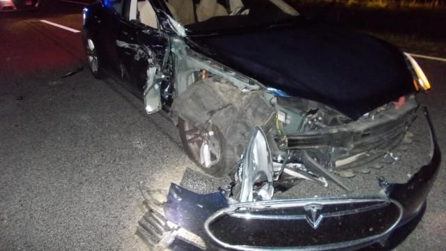 Photo of the Tesla that was crushed during a crash on US Highway 64 on Wednesday. Officials say that the doctor who was driving this car was watching a movie and was driving the car on autopilot mode.