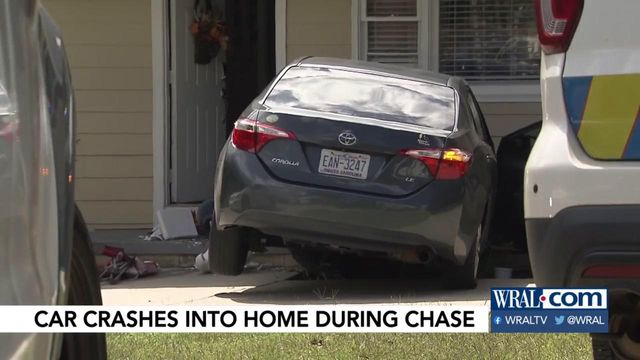 Car crashes into home during chase