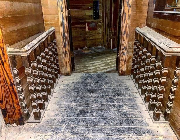 The tavern was sealed behind drywall for decades, leaving the dust-coated insides an untouched time capsule from when it was first sealed.