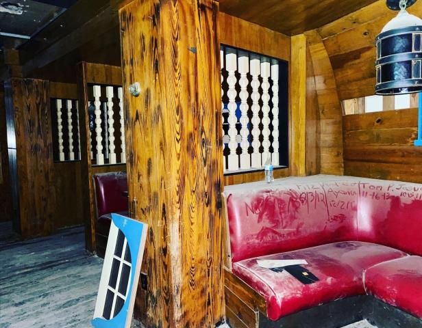 The tavern was sealed behind drywall for decades, leaving the dust-coated insides an untouched time capsule from when it was first sealed.
