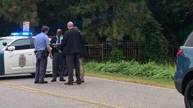 Raleigh police were seen searching under a footbridge