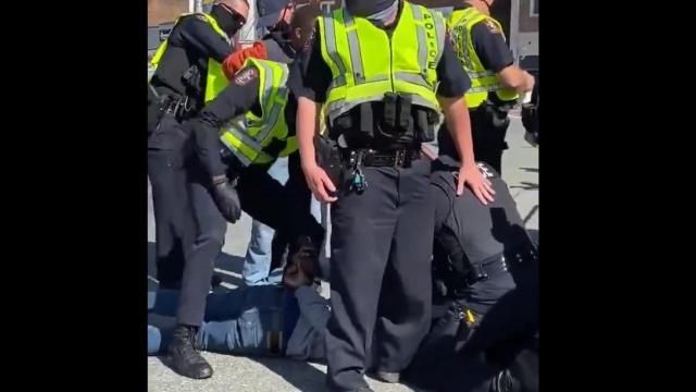 Arrests being made in Graham during an anti-racism protest. Photos from @alexcovello on Twitter.