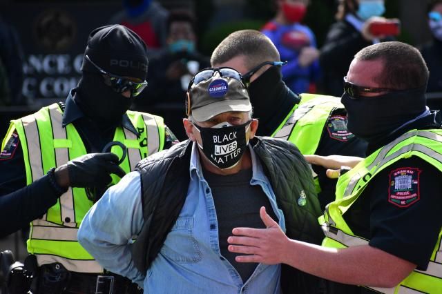 Man with Black Lives Matter mask is being arrested by Graham Police.