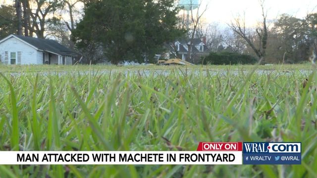 Man attacked with machete in front yard