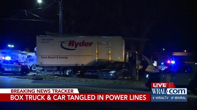 Two cars tangled in power lines after crash 