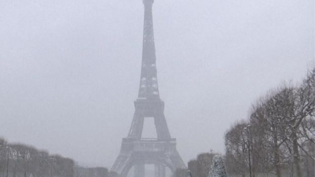 Snowfall coats downtown Paris 