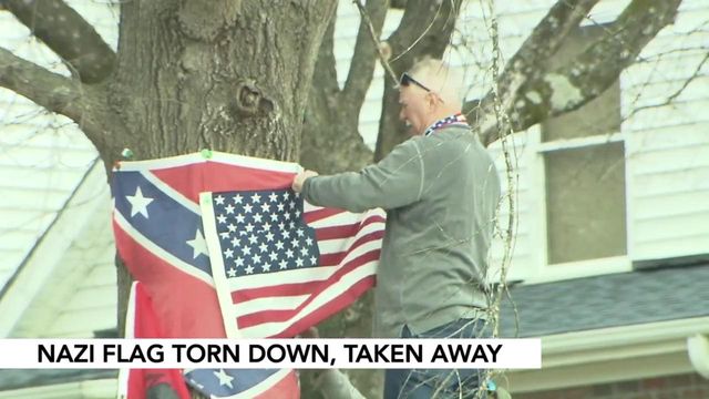 Man replaces Nazi flag with American flag
