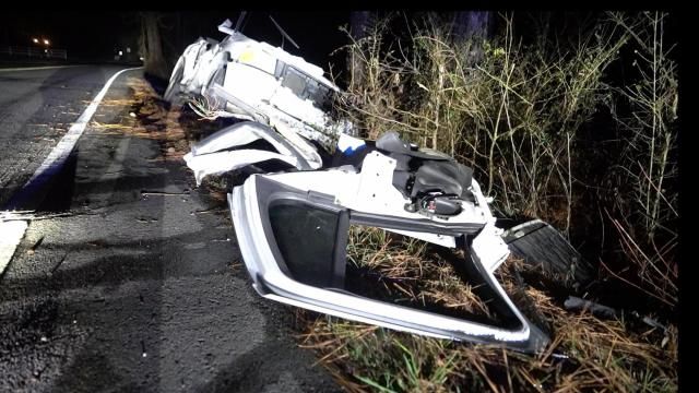 Crews work to free driver after vehicle loses control on black ice ...