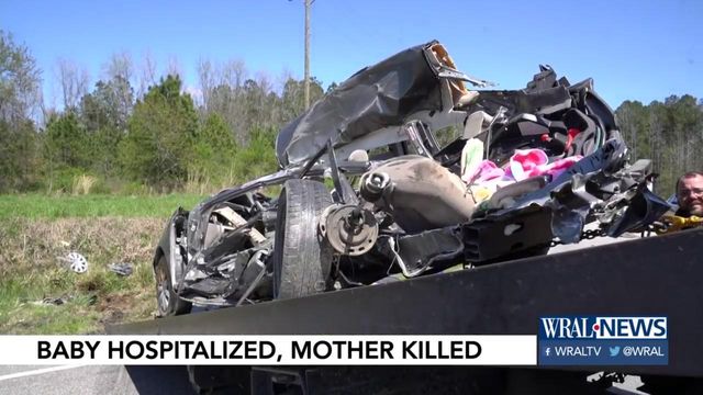 One woman dead, baby hospitalized after car collides with dump truck