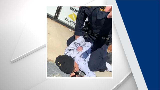 Raw: Video shows teen pinned by Raleigh officer