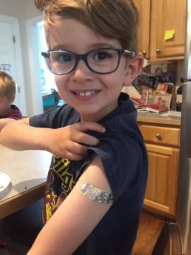 Both brothers, ages 5 and 7, got a COVID vaccine as part of a trial at Duke.