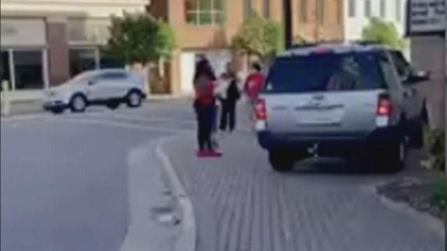 The SUV ran up on the side of the curb at a high speed where protesters were gathered, according to video.