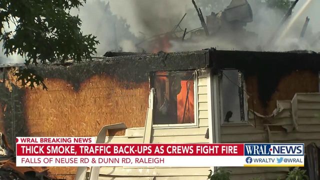 Thick smoke, traffic backups as crews fight Raleigh house fire