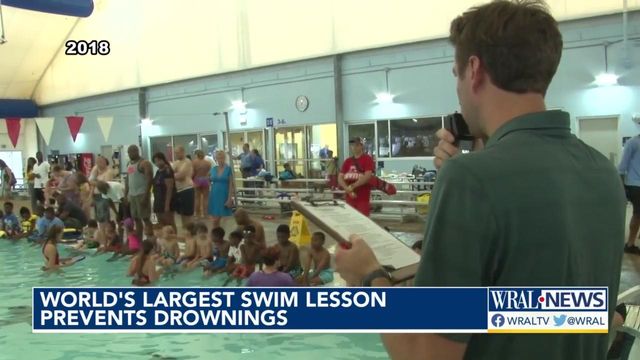 Raleigh kids jump in Into the pool for the world's largest swim lesson