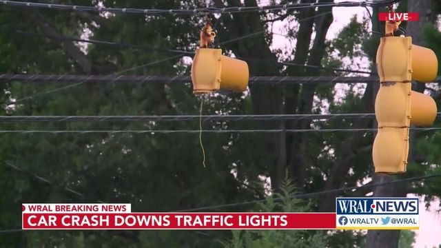 Two crashes close major roadways, knock down street lights, power poles