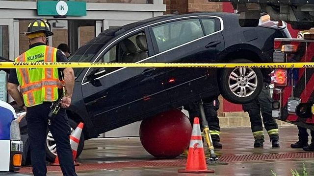 Witness describes scene as car drives over concrete ball at Target
