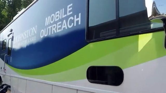Mobile unit treating infected people in Benson