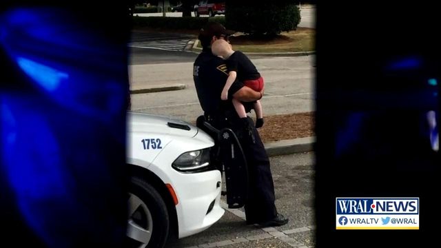 Fayetteville police department photo of officer, child goes viral 
