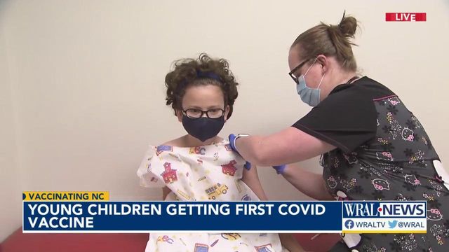 Young children lining up to get their first COVID-19 vaccine