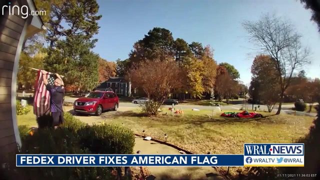 Charlotte FedEx driver picks up American flag during package delivery 