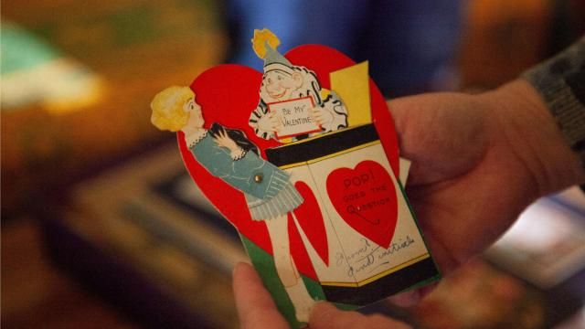 Sliwka shows the mechanical features of Valentine’s Day cards. “I’m a person who collects a lot of things… which I guess makes me a bit of an escapist, but you know, that’s good.” Photo by Carmen Chamblee.