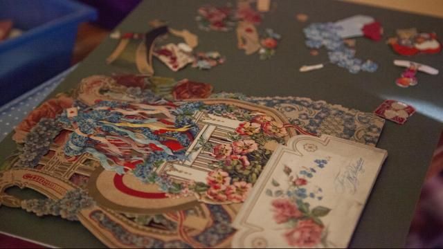 Jolene showcases a Valentine’s Day piece from artists like Ester Howland and Frances Brundage, “One of the crazy things about this is the valentines we remember are the school ones we exchange. But some of these ones would cost $50 back in 1870.” Photo by Carmen Chamblee.