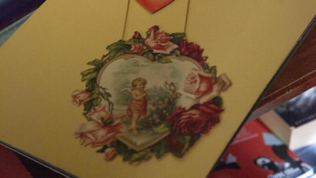 Jolene showcases a Valentine’s Day piece from artists like Ester Howland and Frances Brundage, “One of the crazy things about this is the valentines we remember are the school ones we exchange. But some of these ones would cost $50 back in 1870.” Photo by Carmen Chamblee.