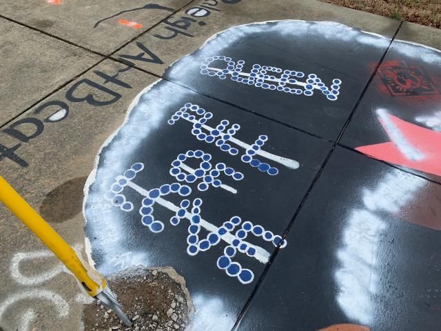 Mural supporting Black lives near Shaw University defaced with markings from white supremacist group 'Patriot Front.'