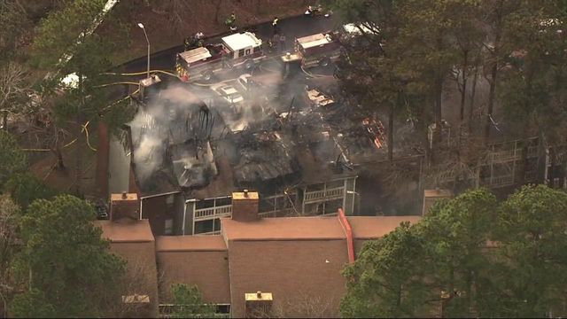 Fire blazes at Cary apartments, trapping people inside 