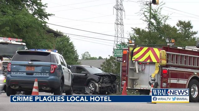 Woman dragged by car before crash near east Raleigh hotel
