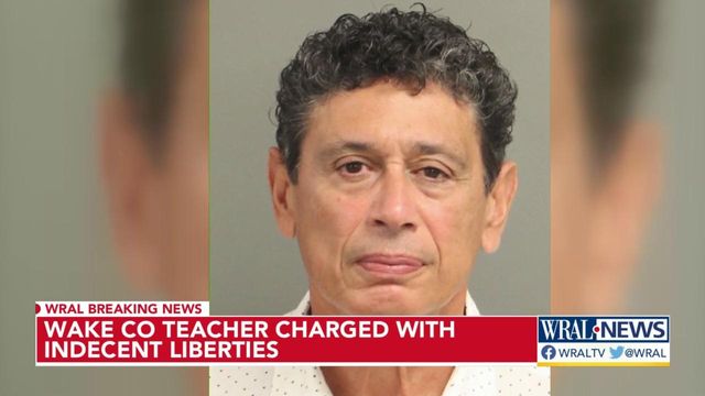 Teacher charged with indecent liberties with a child had been at school nearly 20 years 