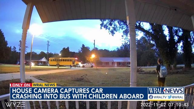 Camera shows car crashing into school bus with children aboard in Lumberton