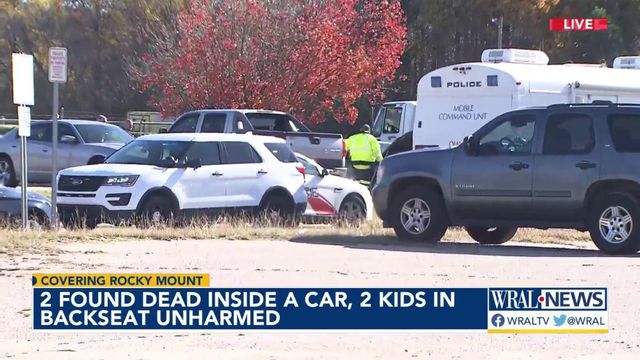 Two found dead inside car, 2 young children in back seat unharmed