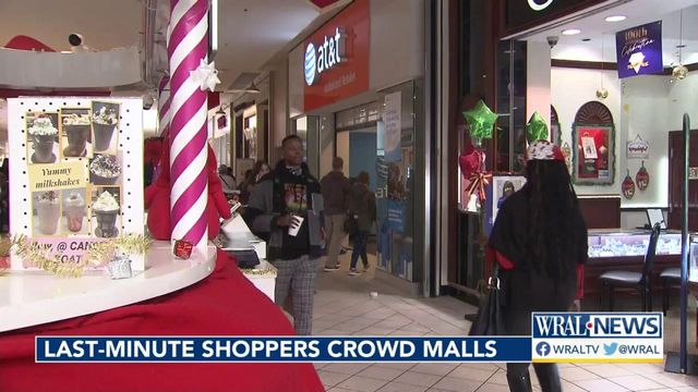 Procrastinating holiday shoppers fill the aisles at Cross Creek Mall