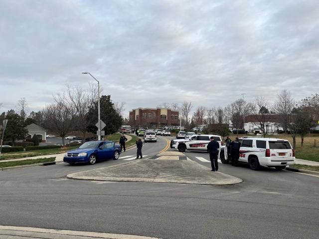 Police surround Cary apartment complex near Walnut Street